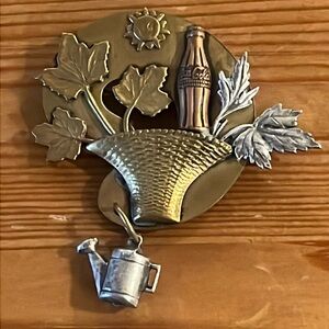 Susan L. Richardson 1993 Mixed
Metal garden basket coke Vintage
DANGLE Brooch